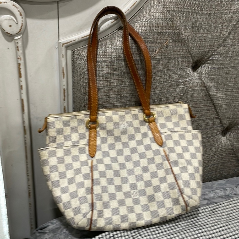 Bought used.Seller said authenticated on Mercari. Some visible wear-see pics.
